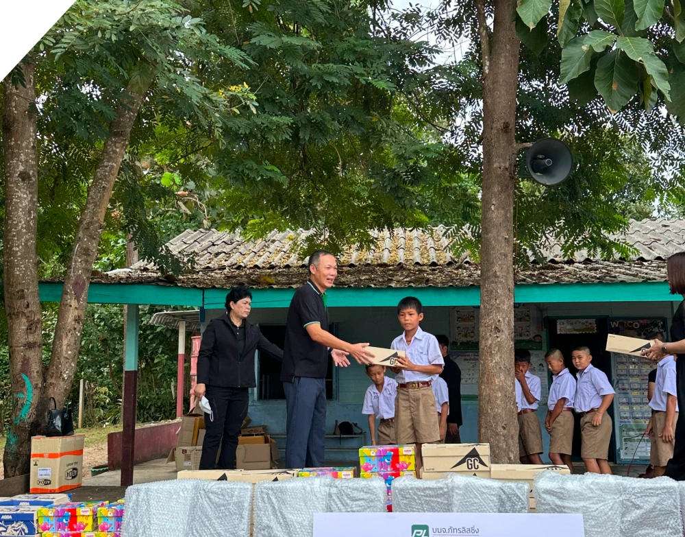 PL Builds the Foundation for Learning: Donating Shoes and Computers in Tak Province