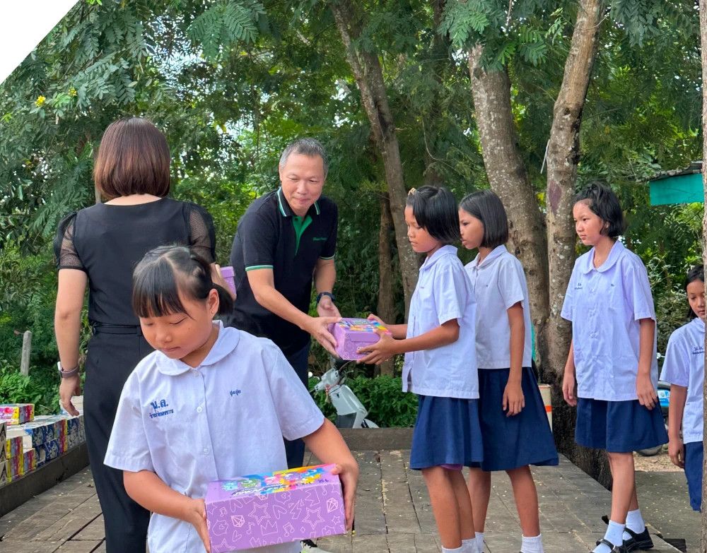 PL Builds the Foundation for Learning: Donating Shoes and Computers in Tak Province